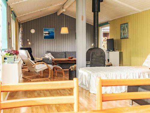 a bedroom with a bed and a living room at 4 person holiday home in Vordingborg-By Traum in Vordingborg