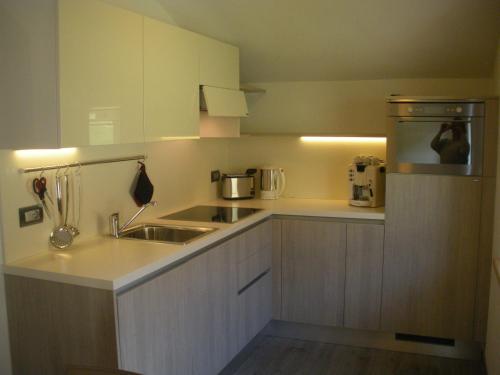 a kitchen with a sink and a counter top at Lucas Haus in Livigno