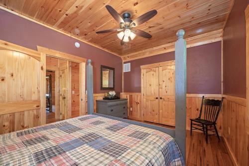 a bedroom with a bed and a ceiling fan at Sky Pointe in Rogers
