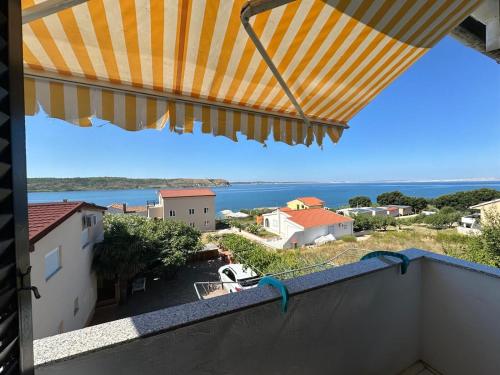 a view of the ocean from the balcony of a house at Apartments Milena in Rtina