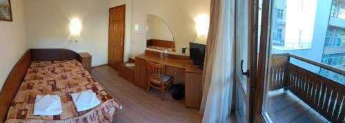 מיטה או מיטות בחדר ב-Medic Hotel