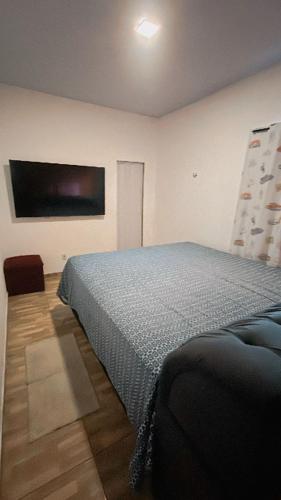 a bedroom with a bed in a room at Casa com motorista somente pra cop 30 in Ananindeua