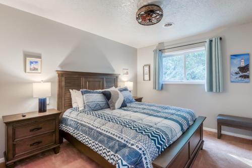 a bedroom with a bed and a window at The Pacific Lookout Sleeps 6, Hot Tub, Pet Friendly, Ocean View, EV Charger in Salishan Beach