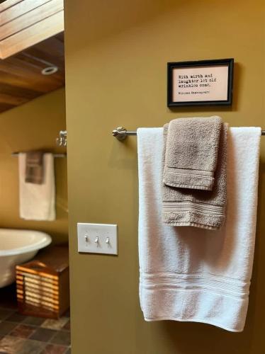 a towel hanging on a towel rack in a bathroom at Sqc Downtown Retreat in Sequim