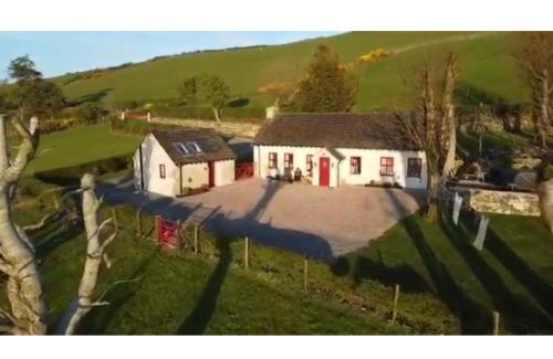 an aerial view of a house in a field at Mc Courts Cottage & Barn in Newry