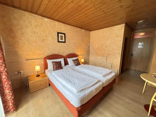 a bedroom with a large bed in a room at Black Forest Hotel Todtnau in Todtnau