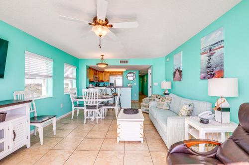 a living room with a couch and a table at Myrtle Beachfront Bliss Pools, Views and SkyWheel! in Myrtle Beach