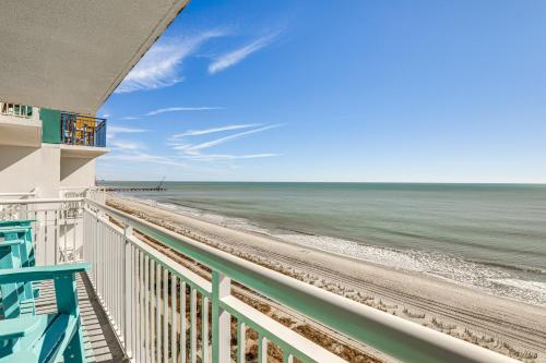a view of the beach from the balcony of a beach house at Myrtle Beachfront Bliss Pools, Views and SkyWheel! in Myrtle Beach
