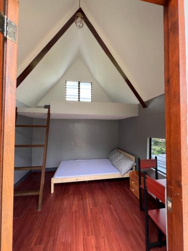 a room with a bunk bed and a window at Hideout sa Babag in Cebu City
