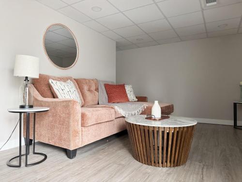 a living room with a couch and a table at RiverStone Retreat - Newburgh IN Stylish Apartments in Newburgh