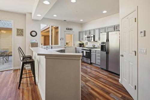 a kitchen with white cabinets and a counter top at Old Mill Magic in Bend