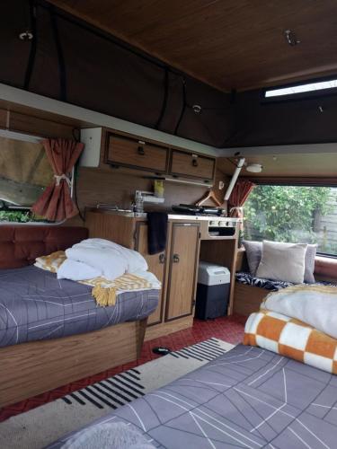 an inside view of an rv with two beds at Blissful Rental Caravan hire and Bnb in Motueka