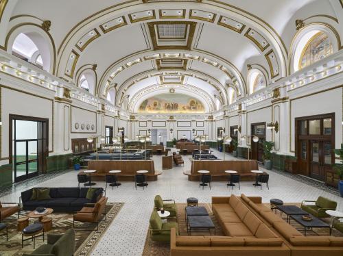 an image of the lobby of a building with couches and tables at Asher Adams, Autograph Collection in Salt Lake City