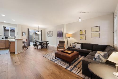 a living room with a couch and a table at Tranquility on the Bluffs in Bend