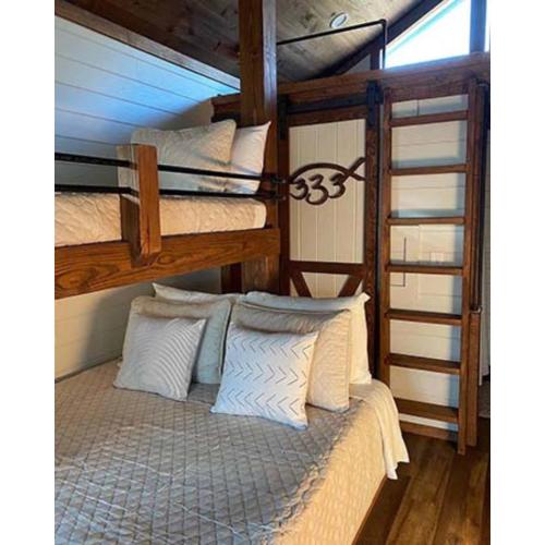 a couple of bunk beds in a room at Crescent Fish Camp, RV Resort & Marina in Crescent City