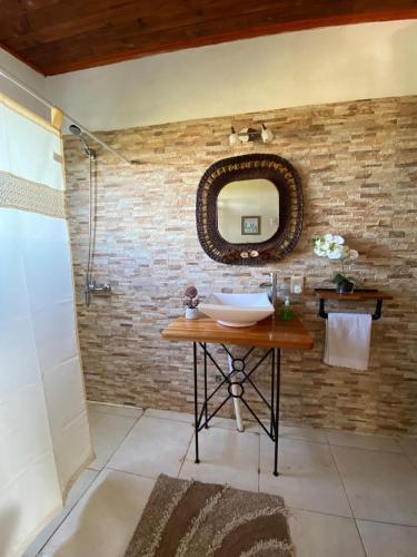 a bathroom with a sink and a mirror at Chacra Mahatma in Tacuarembó