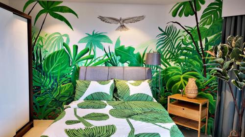 Cama o camas de una habitación en Dominiks Green Heaven Epic Ocean View Tambuli Pool