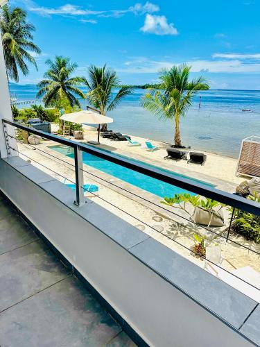 a view of the beach from the balcony of a resort at Pension Irivai, appartement UO UO 3 chambres vue mer in Uturoa