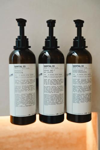 a group of three bottles sitting on a table at Trobbu Boutique Collection Tulum - All inclusive in Tulum