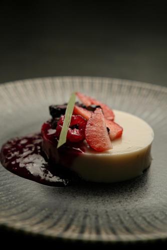 a chocolate dessert with strawberries on a plate at Trobbu Boutique Collection Tulum - All inclusive in Tulum