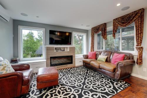 a living room with a couch and a fireplace at Modern Home in Victoria, BC in Victoria