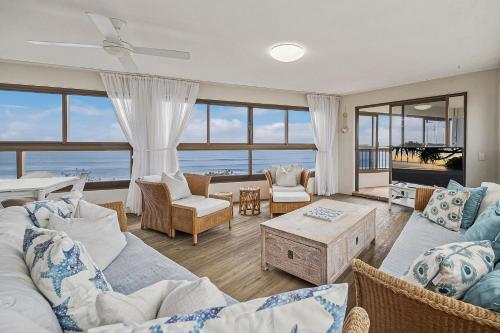 a living room with a view of the ocean at Parkyn Place 6 in Mooloolaba