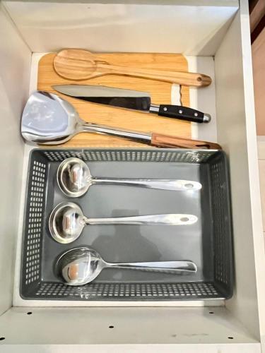 a drawer full of utensils in a box at Nova Sunrise n Mountain view Hilltop Hotel apartment in Nova Cameron Highlands in Brinchang