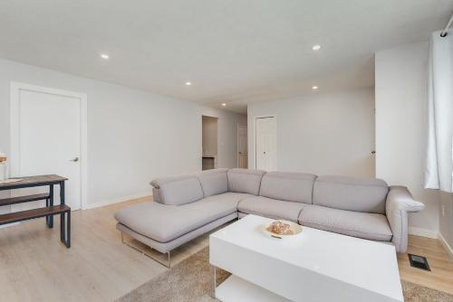 a living room with a couch and a table at Stunning House In Victoria, BC in Victoria