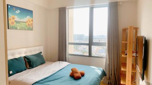 Ένα ή περισσότερα κρεβάτια σε δωμάτιο στο Landmark View 2BR- Masteri Thao Dien