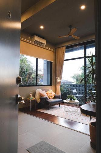a living room with a couch and a large window at Lux Sea Studio 1 in San Juan