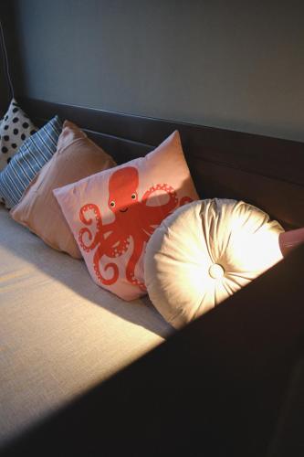 two pillows with an octopus on them on a bed at Lux Sea Studio 1 in San Juan