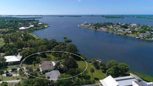 an aerial view of a house on the shore of a lake at HSS1480 in Englewood