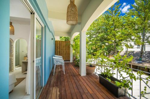 an internal view of a house with a porch with a deck at Bleu de Toi Boutique Hotel in Grand Baie