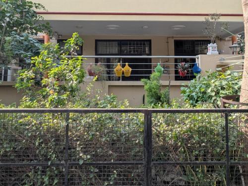 a house with plants on the balcony of it at Excellent Home Away from Home! in Noida