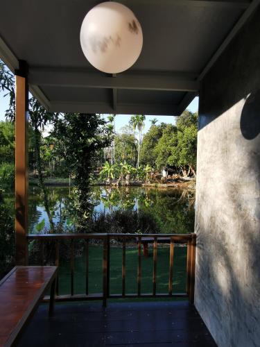 a view of the water from the porch of a house at บ้านพระจันทร์เวียน - House of moon phase in Chachoengsao