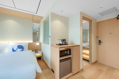 Postel nebo postele na pokoji v ubytování FOX Lite Hotel Majalaya
