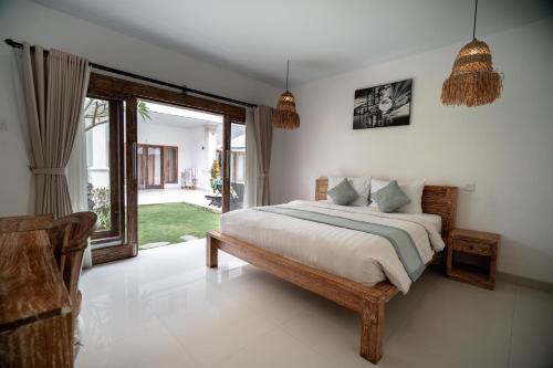 Postel nebo postele na pokoji v ubytování The Eight Villa & Rooms Bali - Seminyak
