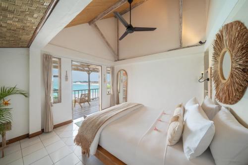 Ένα ή περισσότερα κρεβάτια σε δωμάτιο στο VILLA AMAN - Oceanfront