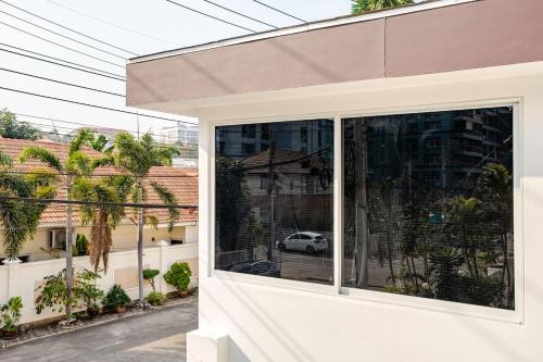a window on the side of a building at G warmth Pool Villa in Pattaya South