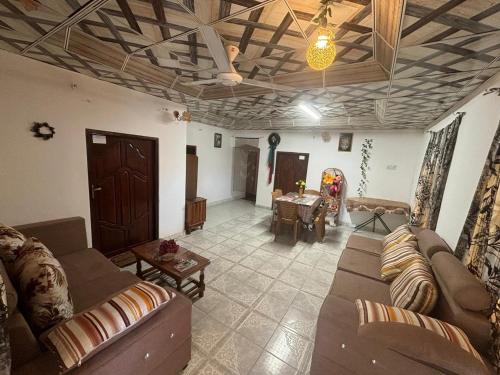 a living room with a couch and a table at Kingjey residence in Kalpitiya