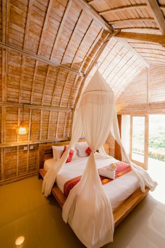 Ένα ή περισσότερα κρεβάτια σε δωμάτιο στο Sunrise Villa Penida