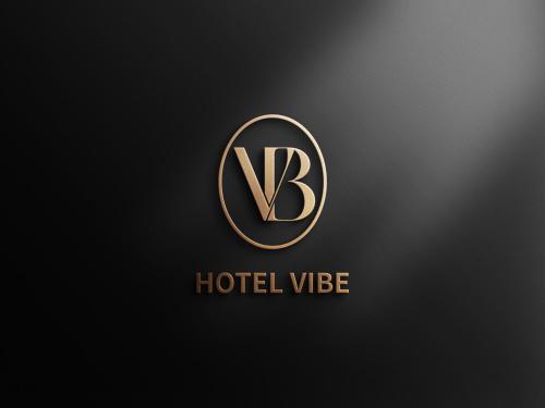 a gold logo with the letter k on a black background at Vibe Hotel Geoje Gohyeon in Geoje 