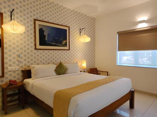 Postel nebo postele na pokoji v ubytování Hotel Aura by Woco Stays