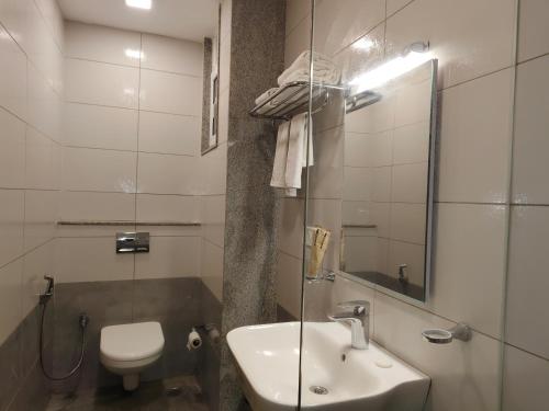 Koupelna v ubytování Hotel Aura by Woco Stays