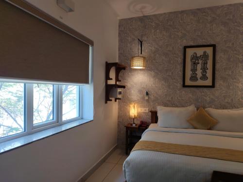 Postel nebo postele na pokoji v ubytování Hotel Aura by Woco Stays