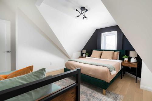 a bedroom with a bed in a attic at Large Victorian Sleeps 6 by UofT in Toronto