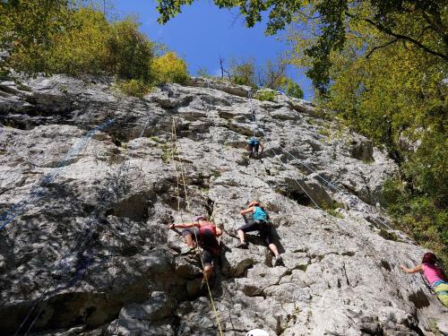 a group of people climbing on a rocky mountain at Casa Vacanze “Bouganville” loc Avane Pisa in Vecchiano
