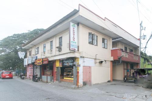 a building on the side of a street at RedDoorz at City Stay Inns Marilao in Lias