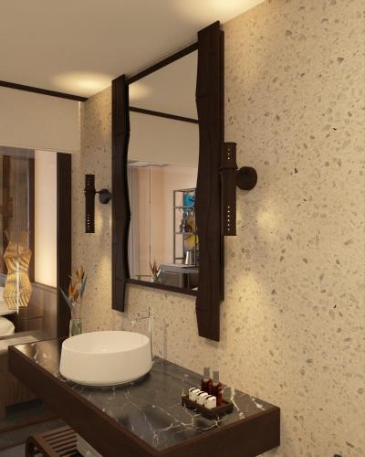a bathroom with a sink and a mirror at Amiana Resort Cam Ranh in Cam Ranh