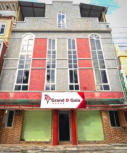 a building with a sign on the front of it at Grand D Gala , Dharmapuri in Dharmapuri